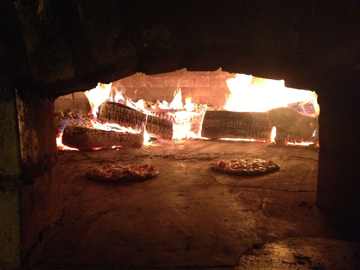 Wood-fired pizza oven at O-Neh-Da Estate, used for rehearsal dinners